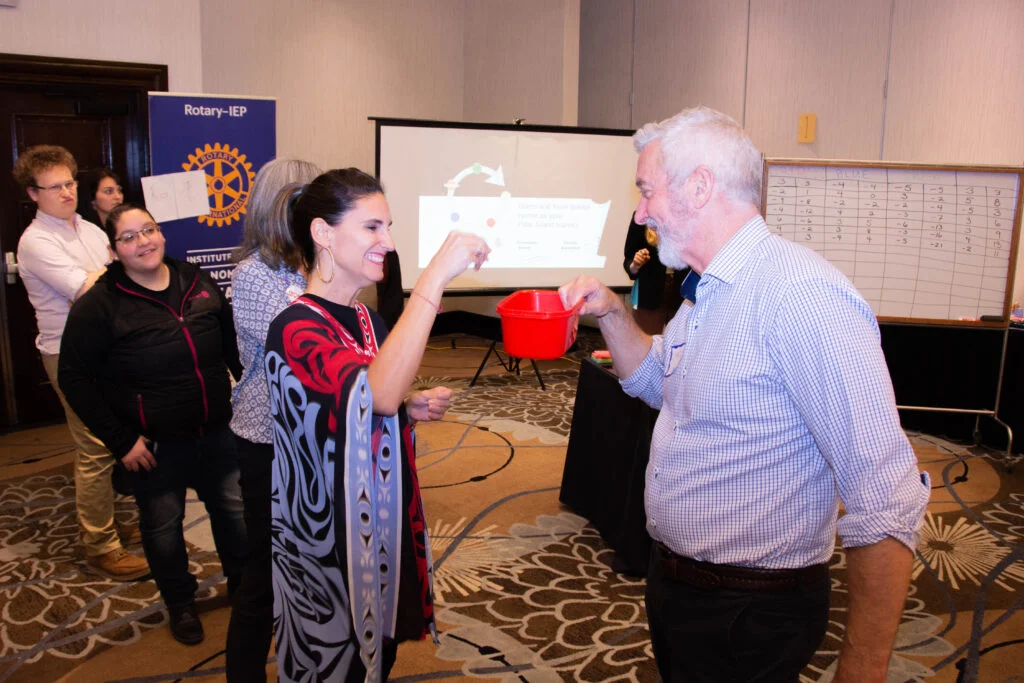 International participants in discussion during a facilitation workshop