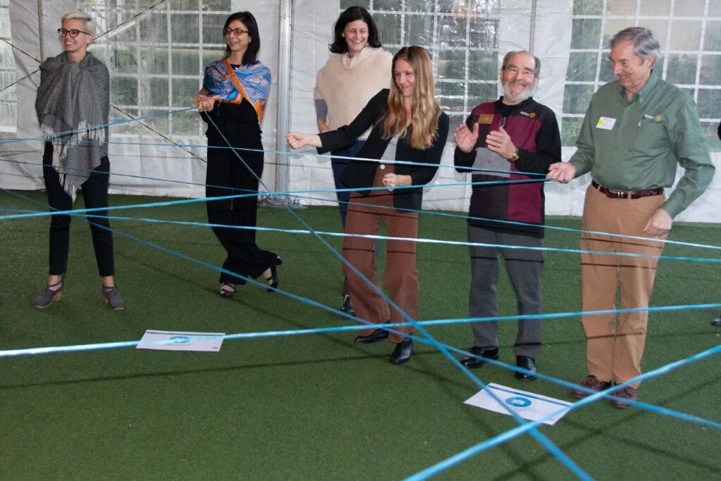 Facilitation exercise with participants mapping relationships outdoors
